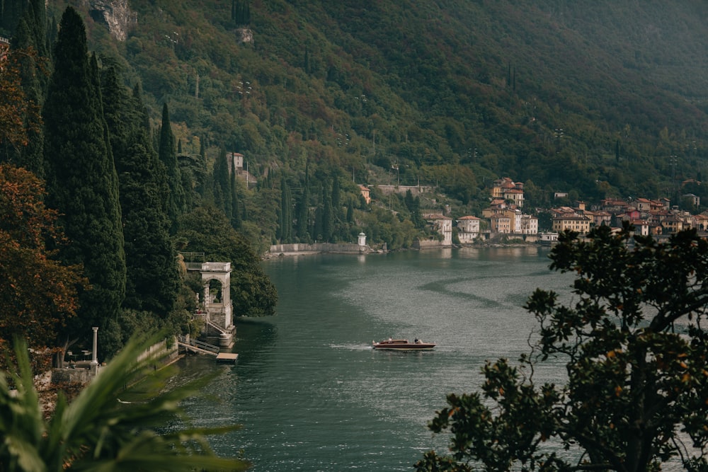 a river with a bridge and a boat on it