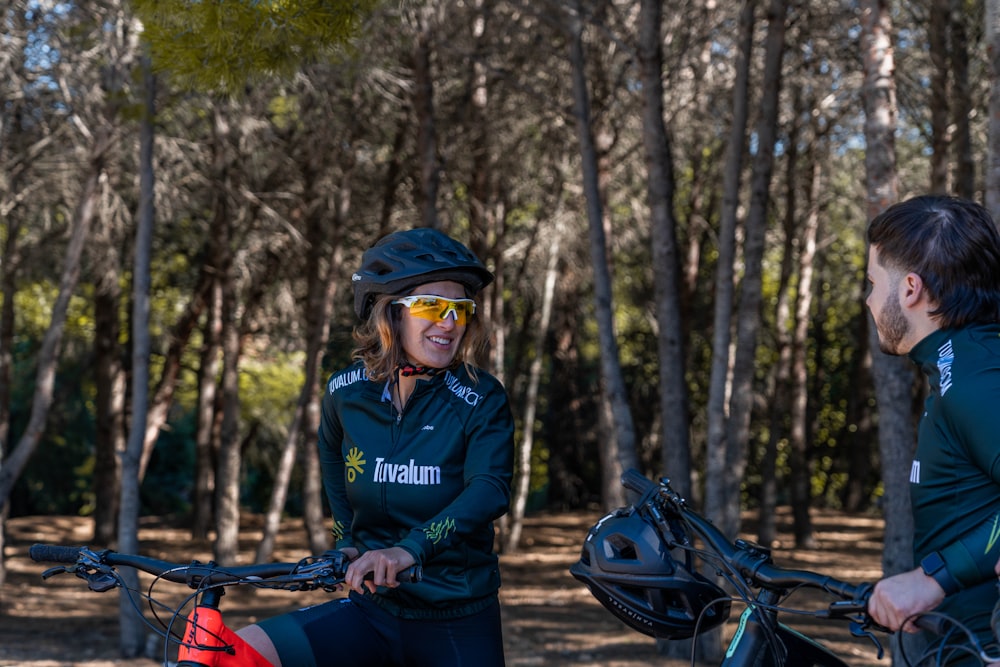 a man and a woman riding bikes