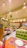 A smiling customer enjoying a fresh meal inside Verdoro’s cozy, green-accented dining area.