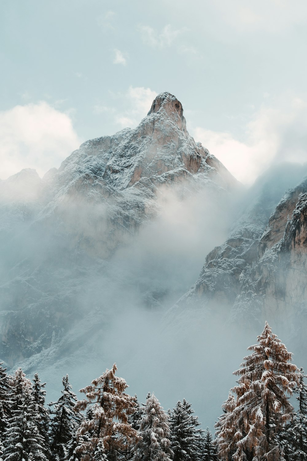 a mountain with clouds