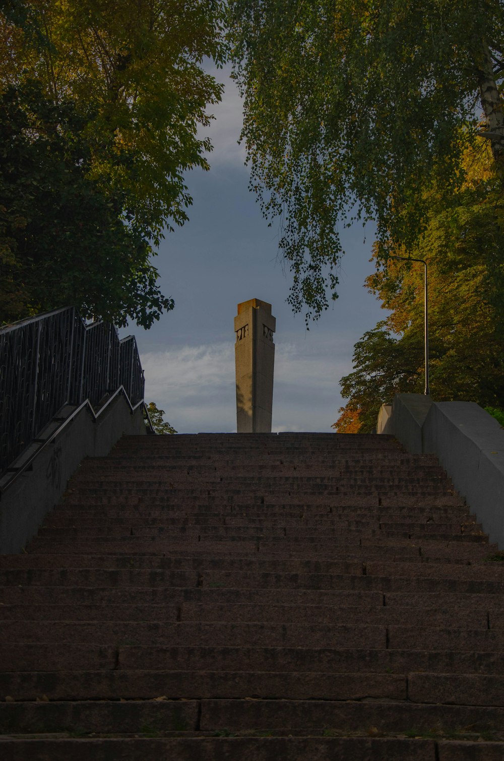 a brick staircase leading up to a tall tower
