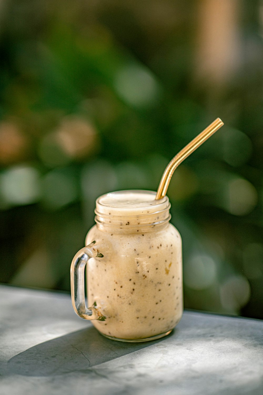 a glass jar with a straw