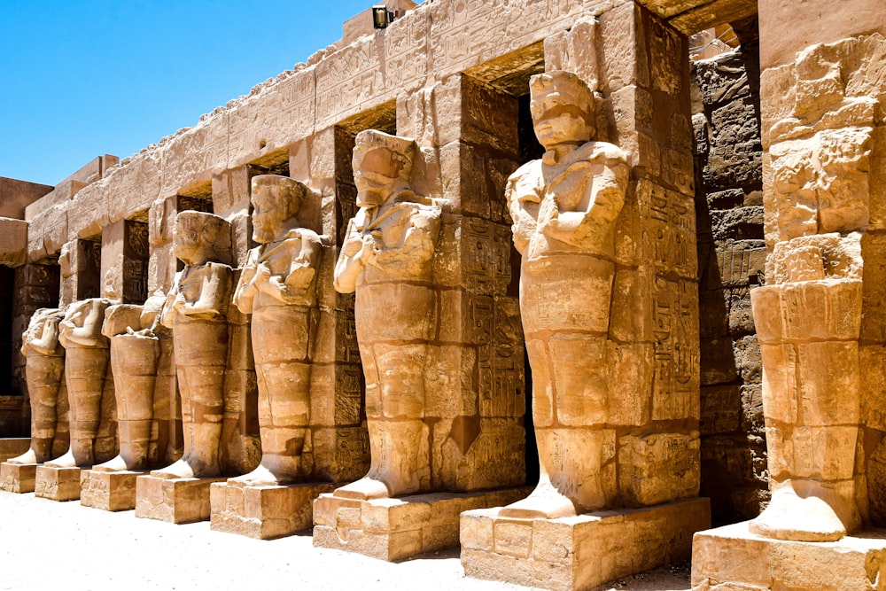 a group of statues in a stone building
