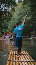 a person on a boat holding a paddle