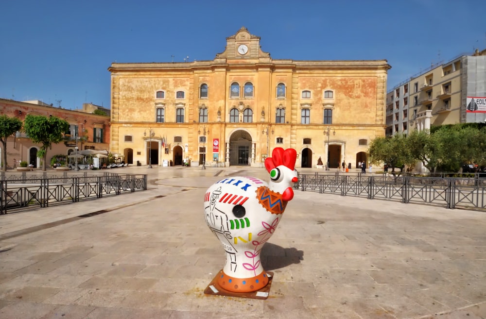 a large building with a large statue in front of it