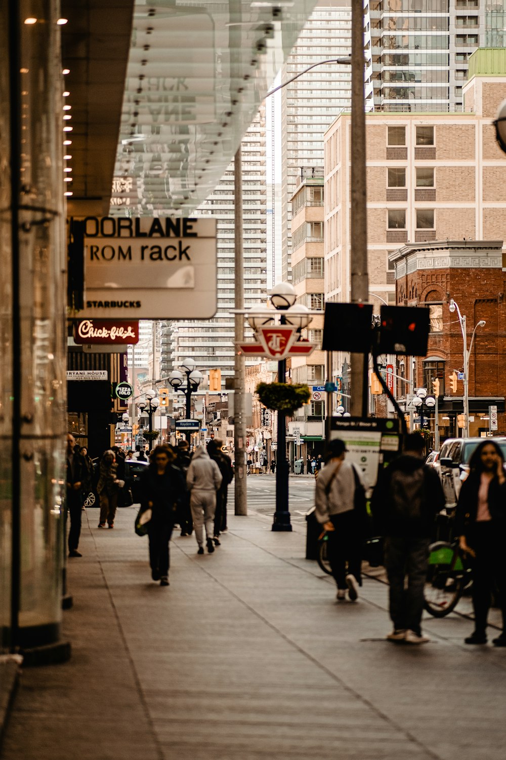 people walking on a sidewalk