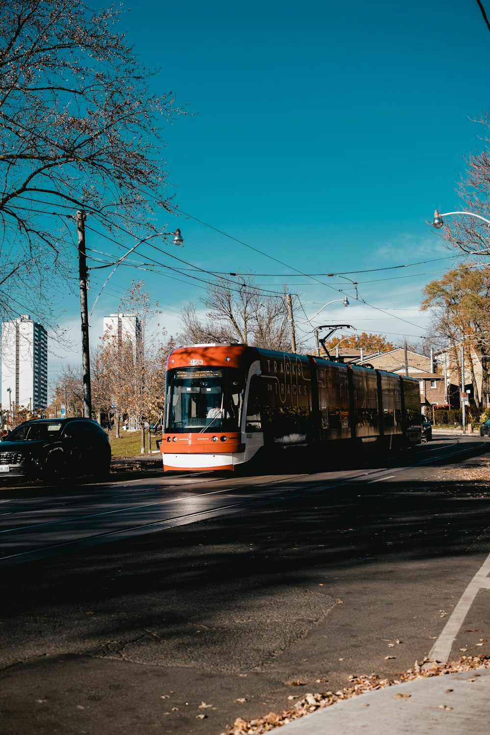 a yellow trolley on a street