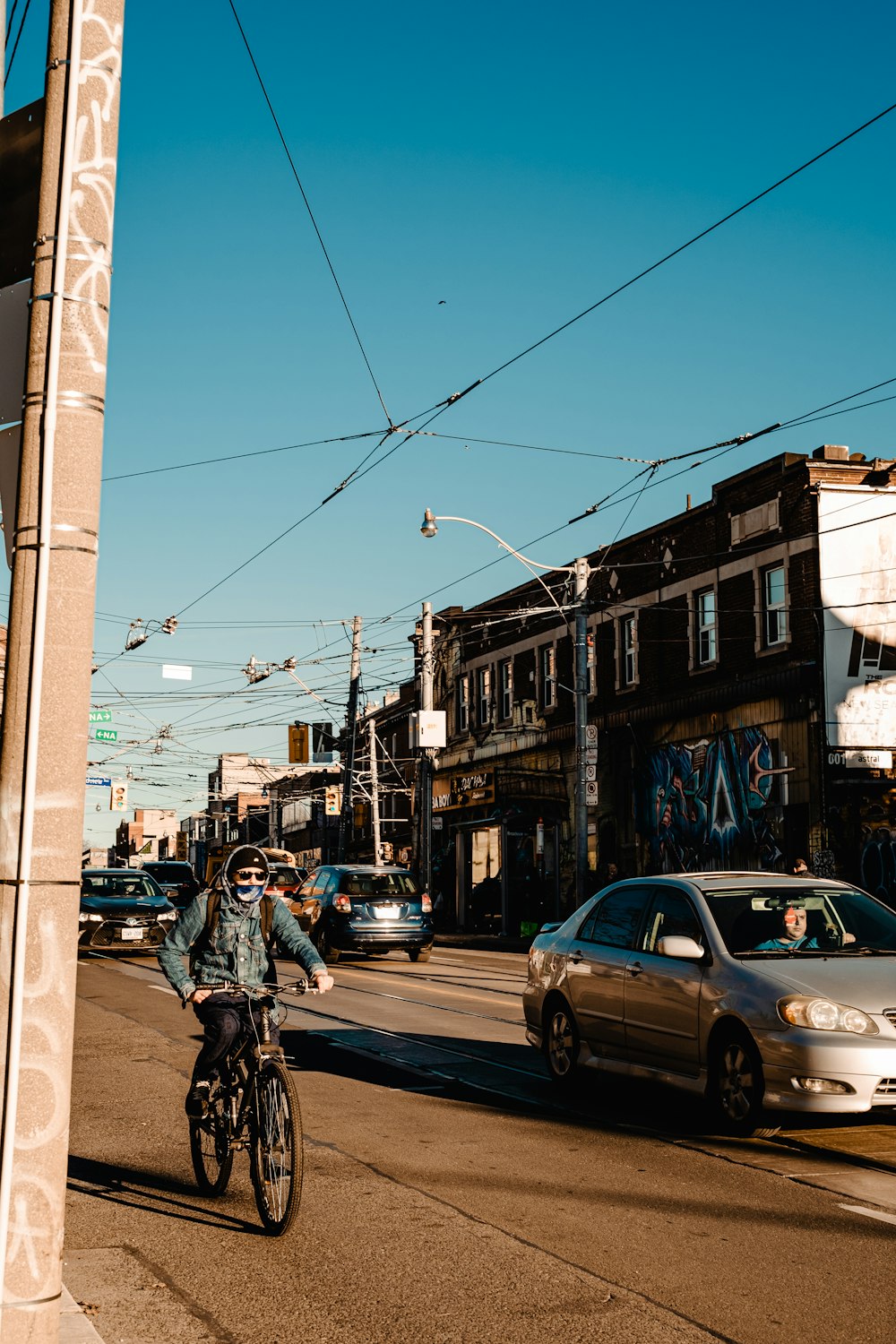 a person riding a bicycle on a street