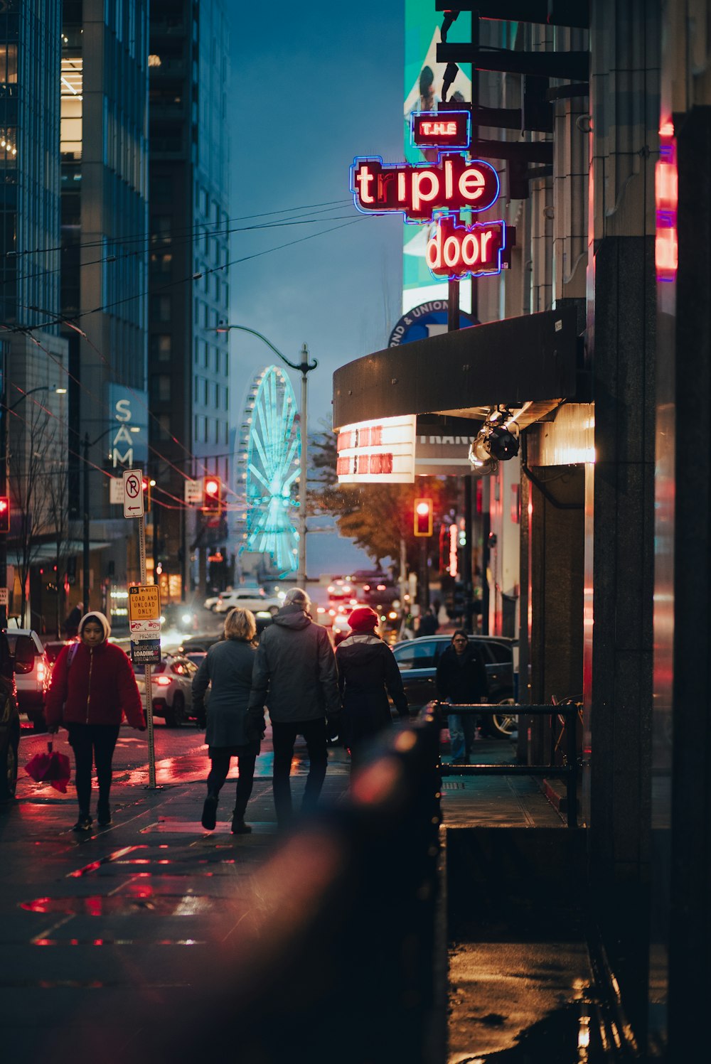 people walking on a sidewalk