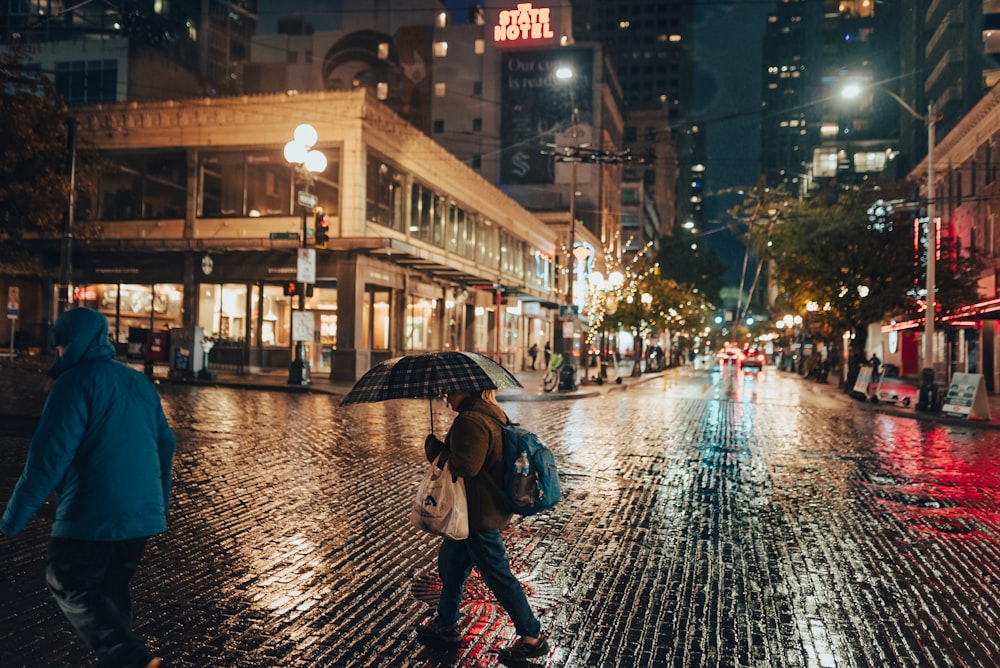 people walking in the rain with umbrellas