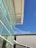 A completed structural steel building showcasing its sleek design against a clear blue sky.