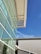 A completed structural steel building showcasing its sleek design against a clear blue sky.
