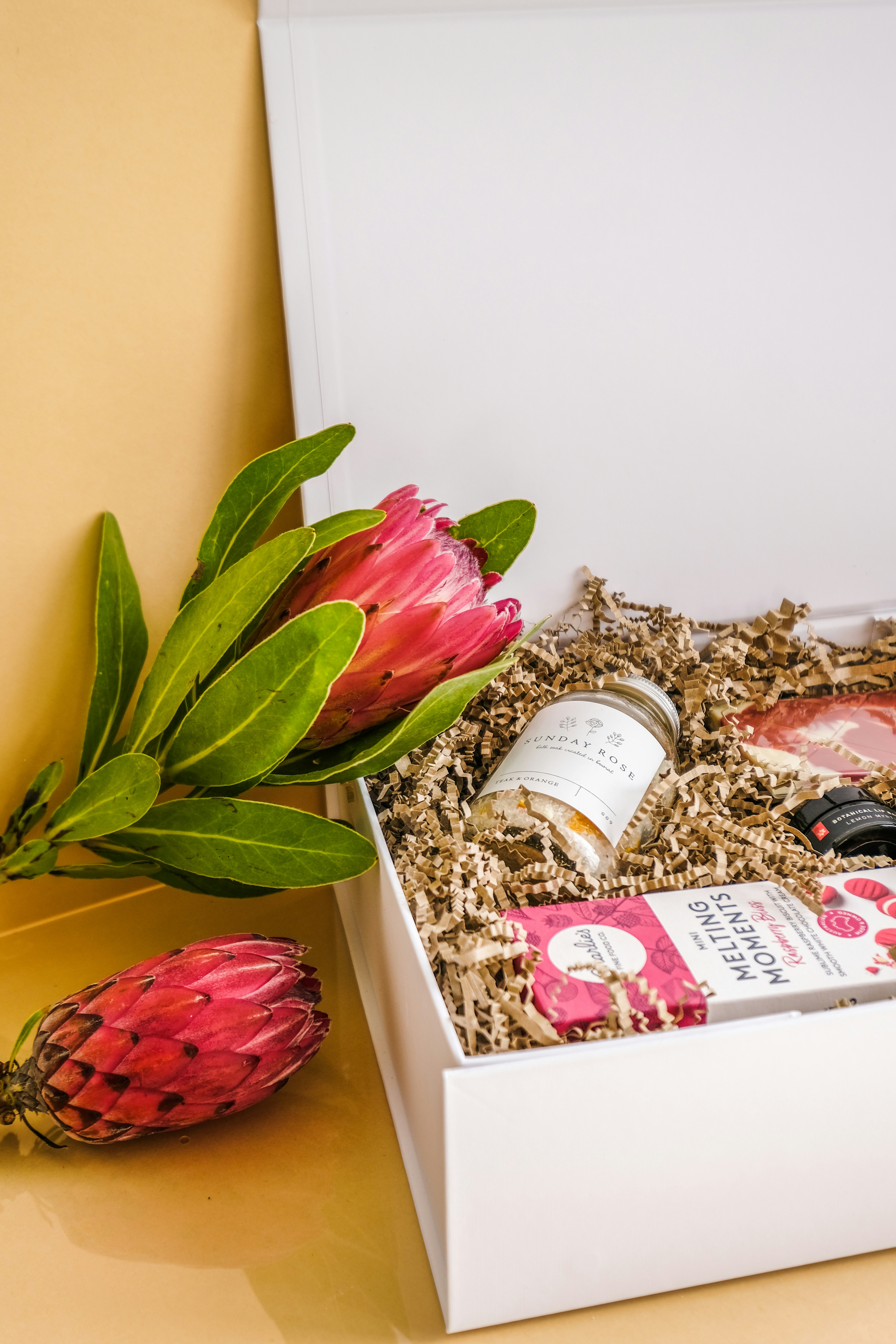 woman wearing yellow long-sleeved dress under white clouds and blue sky during daytime