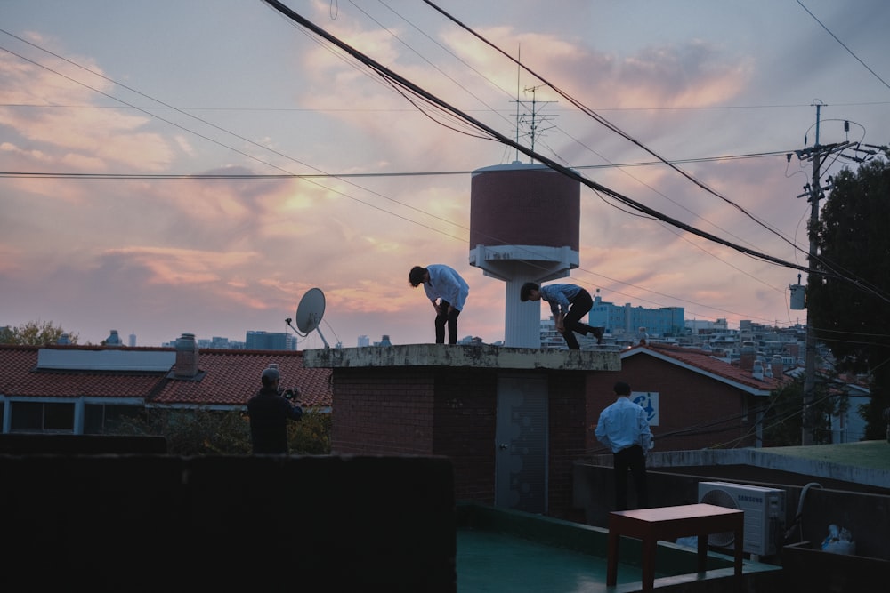 a group of people working on a roof