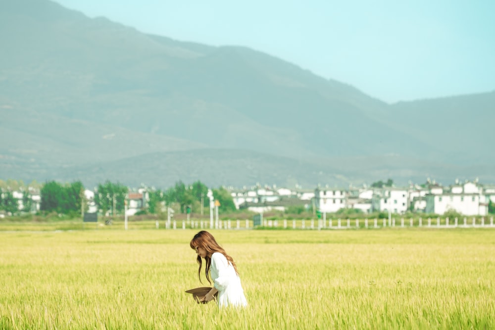 a person sitting in a field