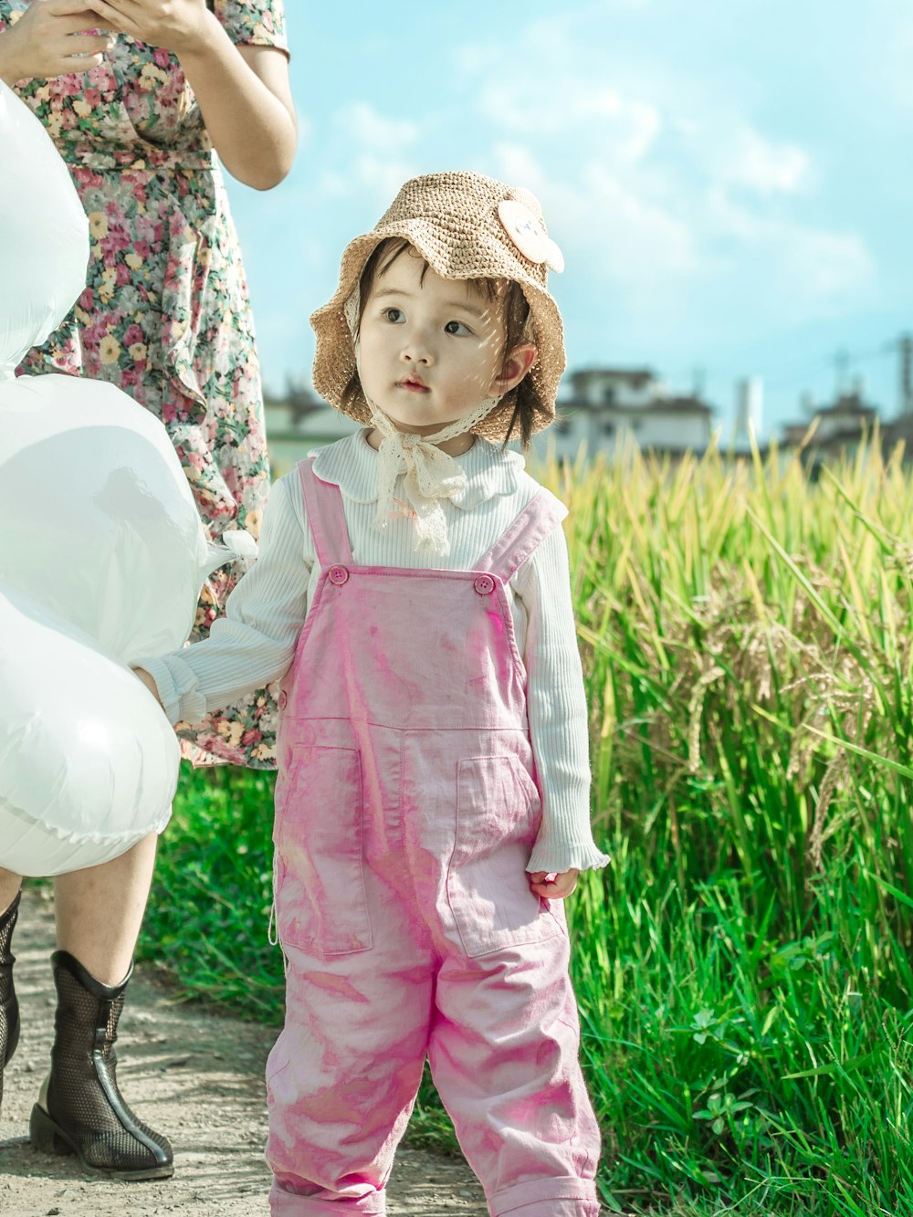 a girl in pink clothes