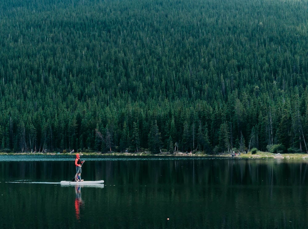 a person on a surfboard in a lake