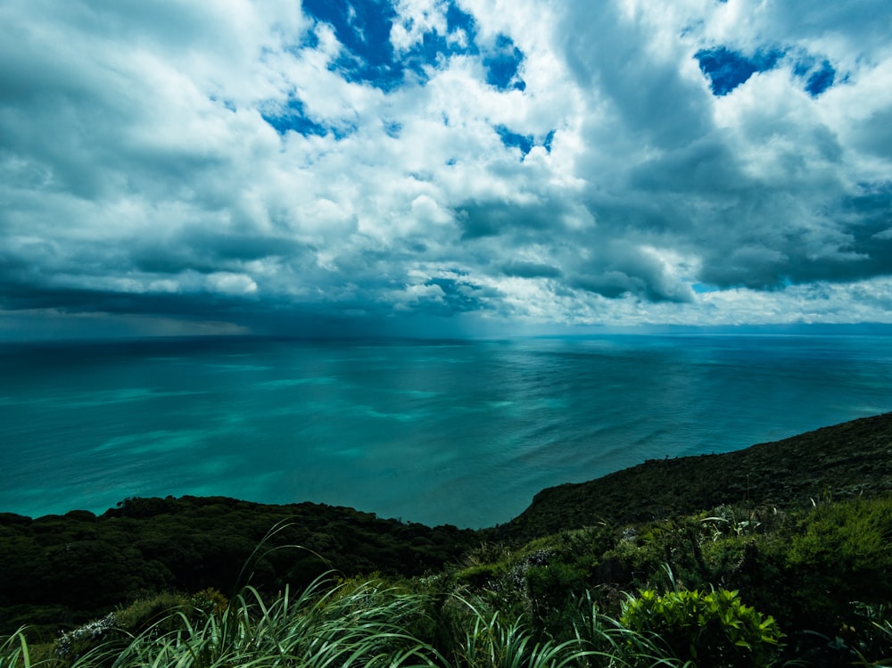 a body of water with hills around it