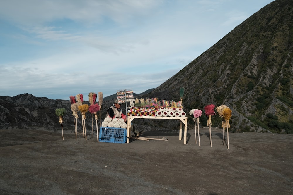 a beach with a boat and umbrellas