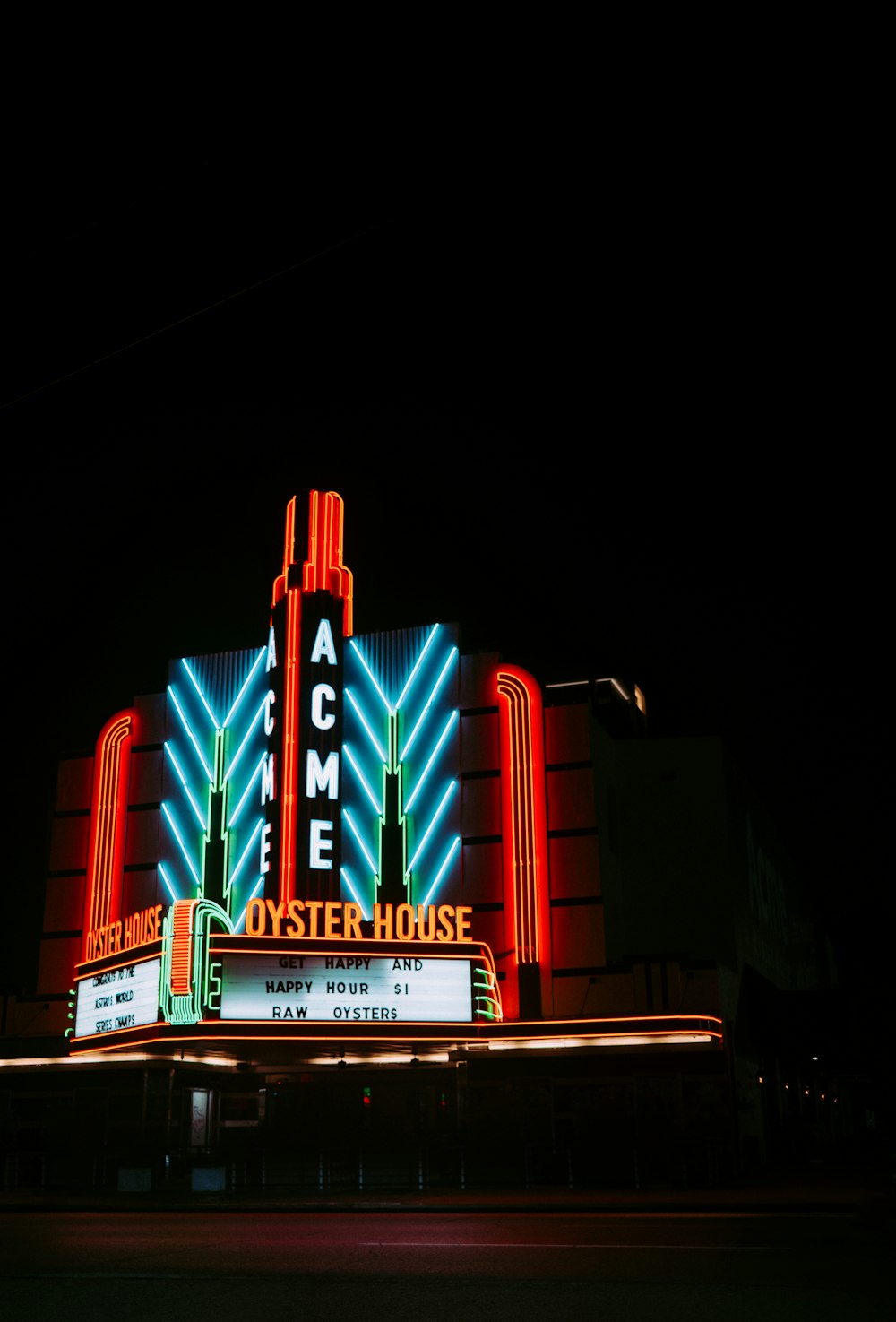 a building with neon signs at night