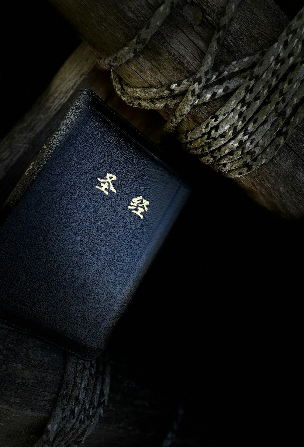 a blue wallet with a gold logo