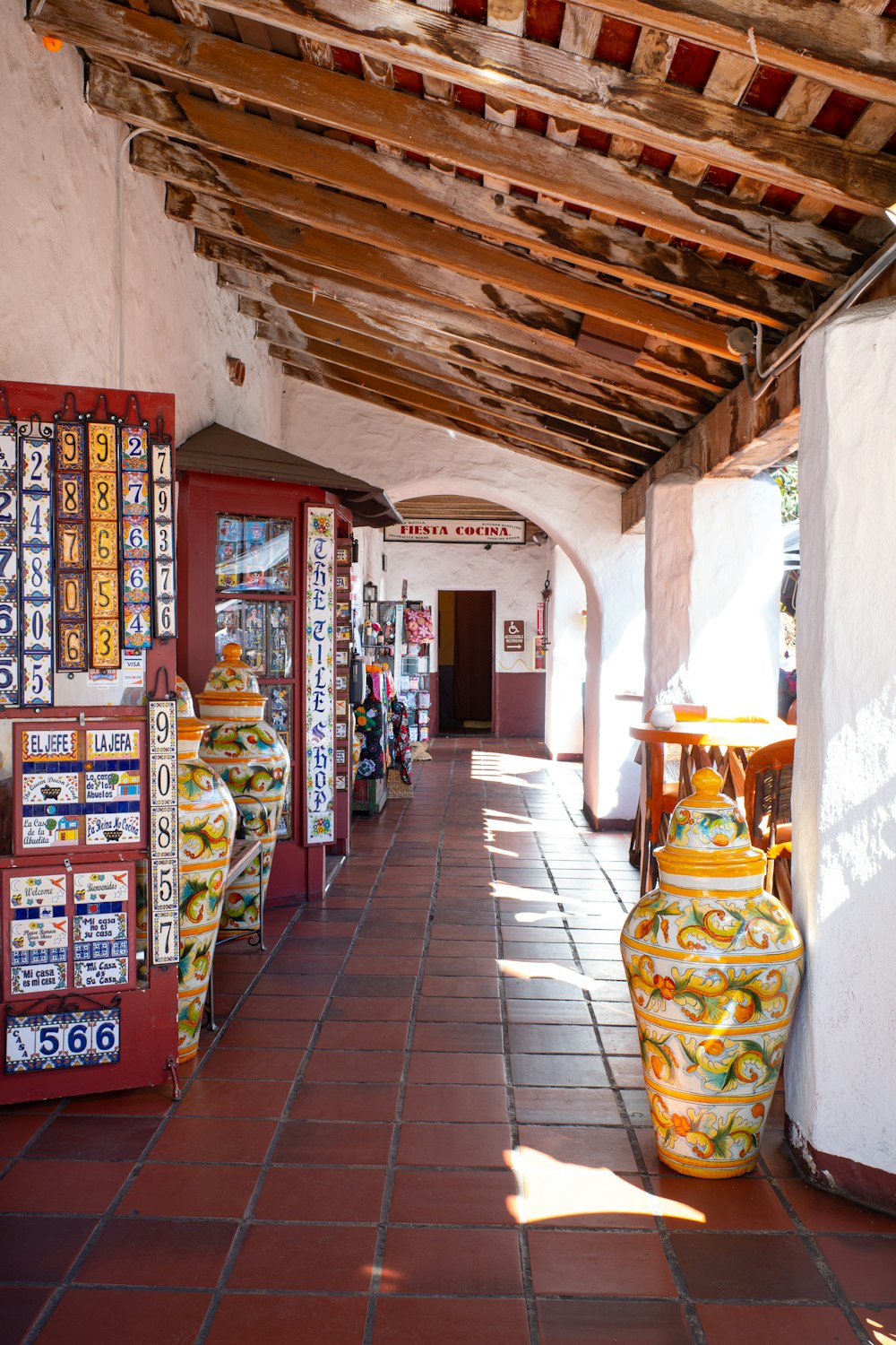 a hallway with many games on the shelves