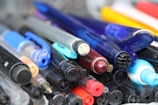 Close-up of elegant ballpens in various colors.