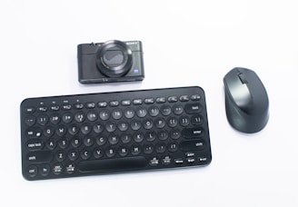 a black computer mouse and a black keyboard