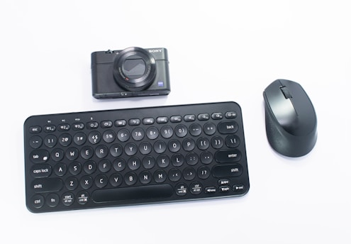a black computer mouse and a black keyboard