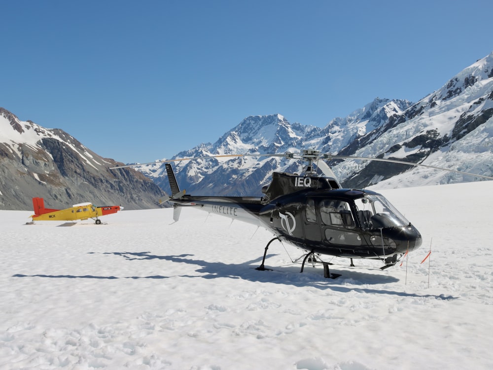 a helicopter on a snowy mountain
