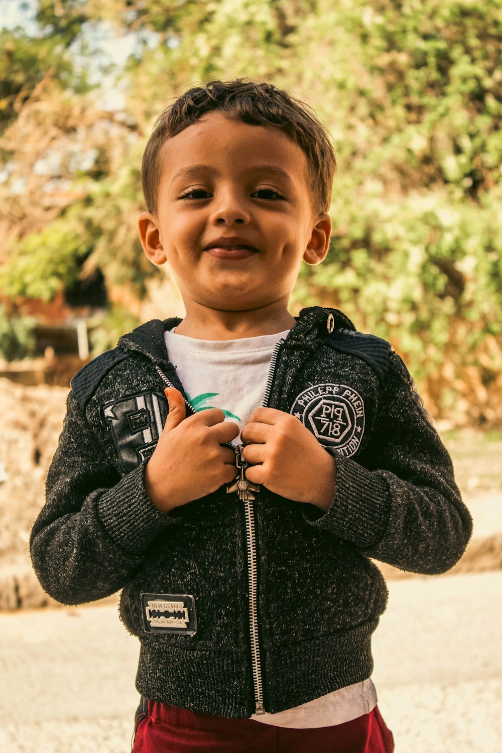 a boy holding a snake