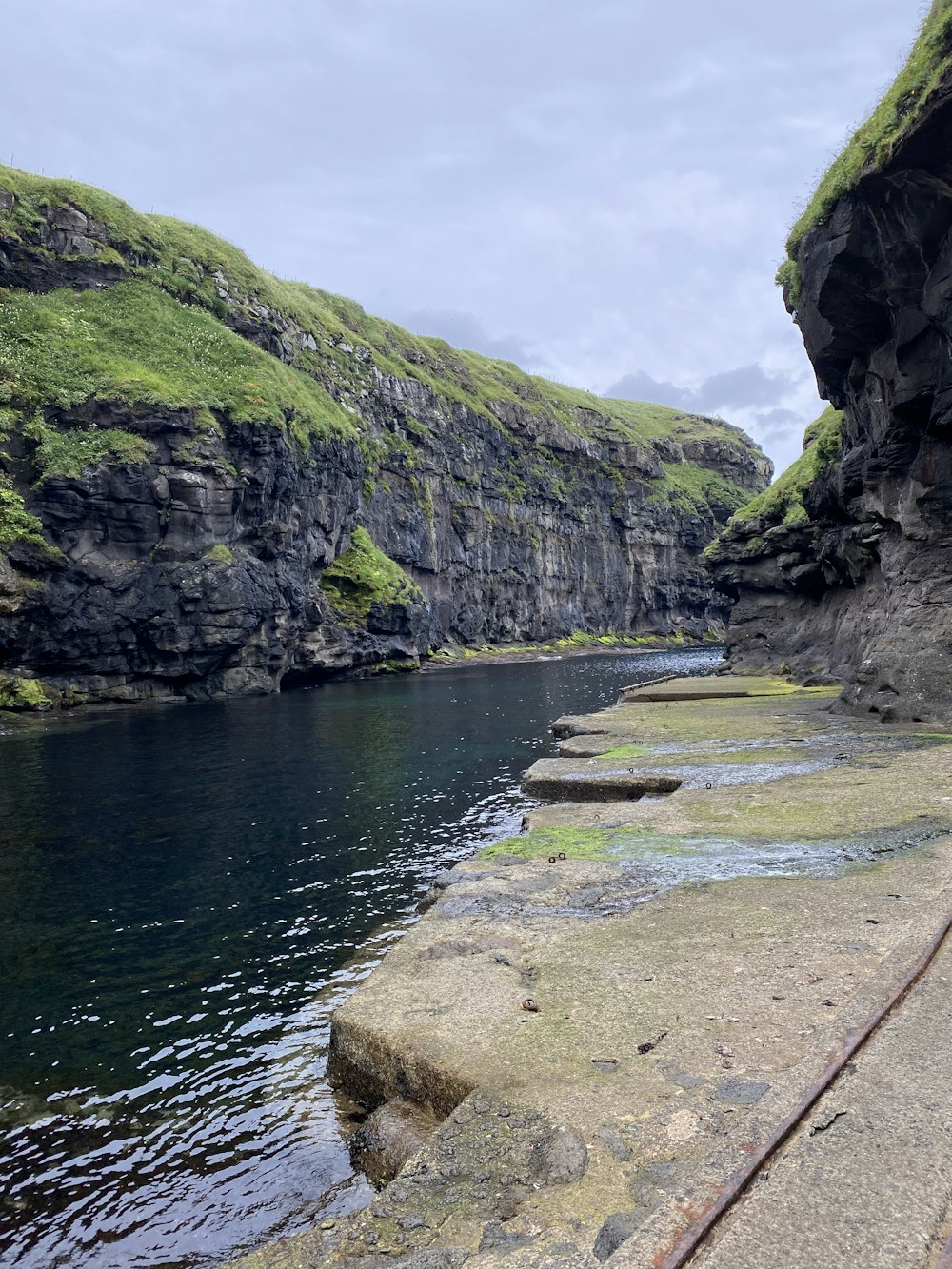 a beach with rocks and a body of water