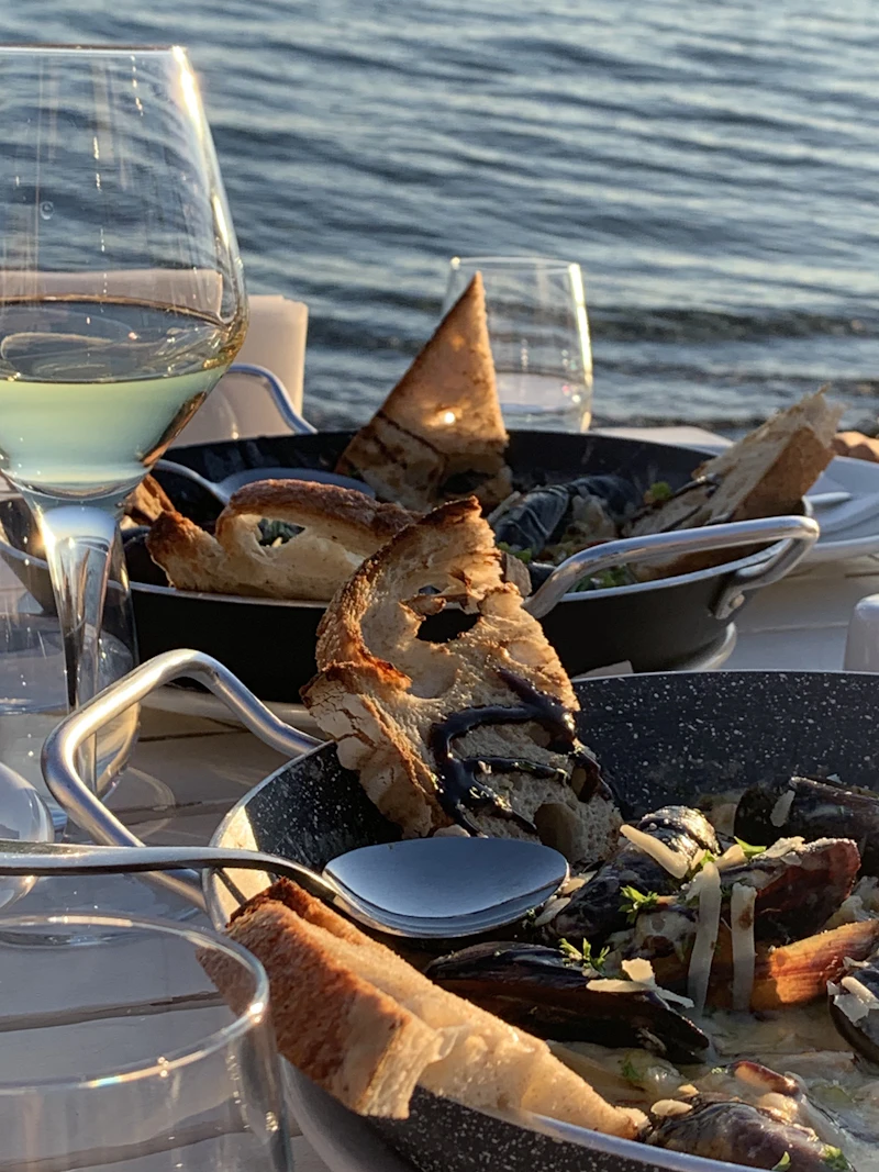 Fresh bread and wine by the sea