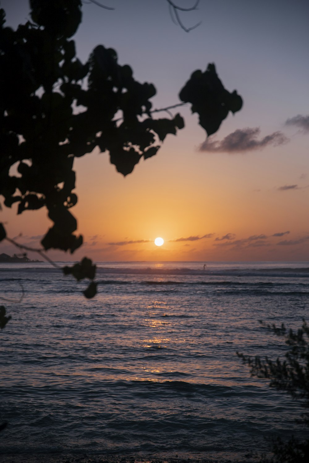 a sunset over a body of water