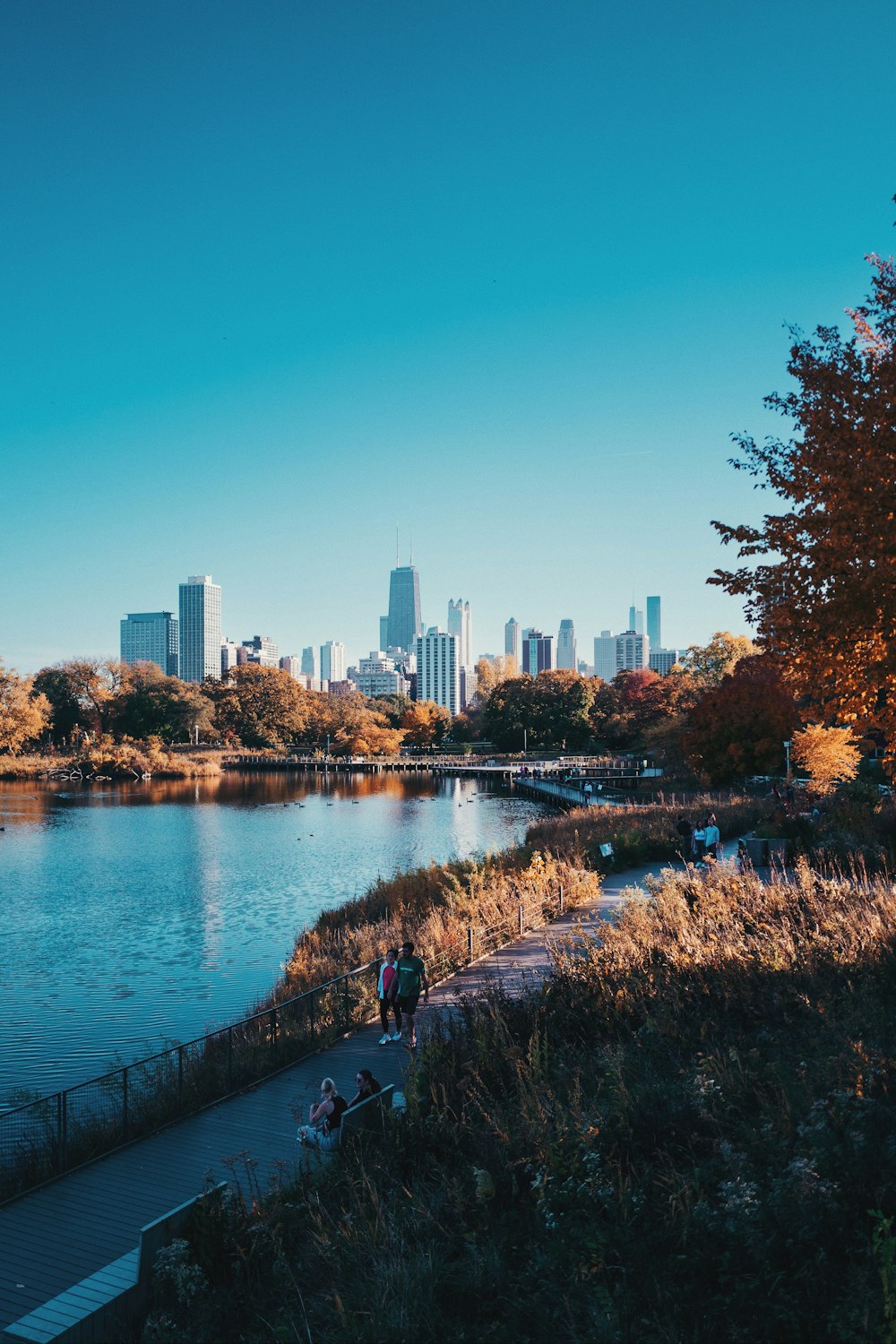 a body of water with a city in the background