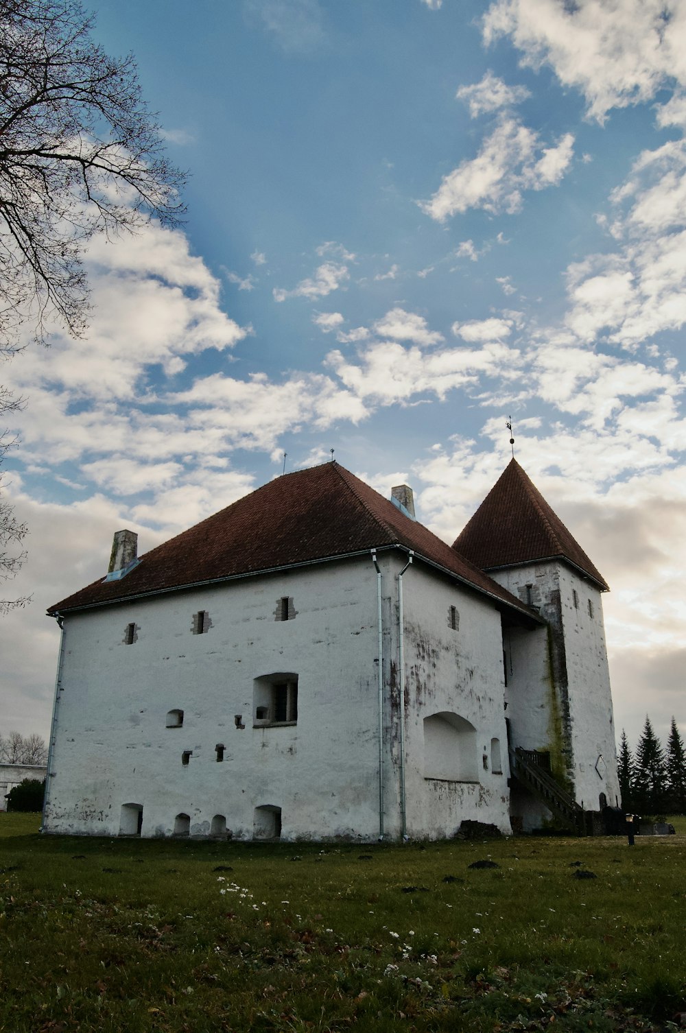 a white building with a red roof