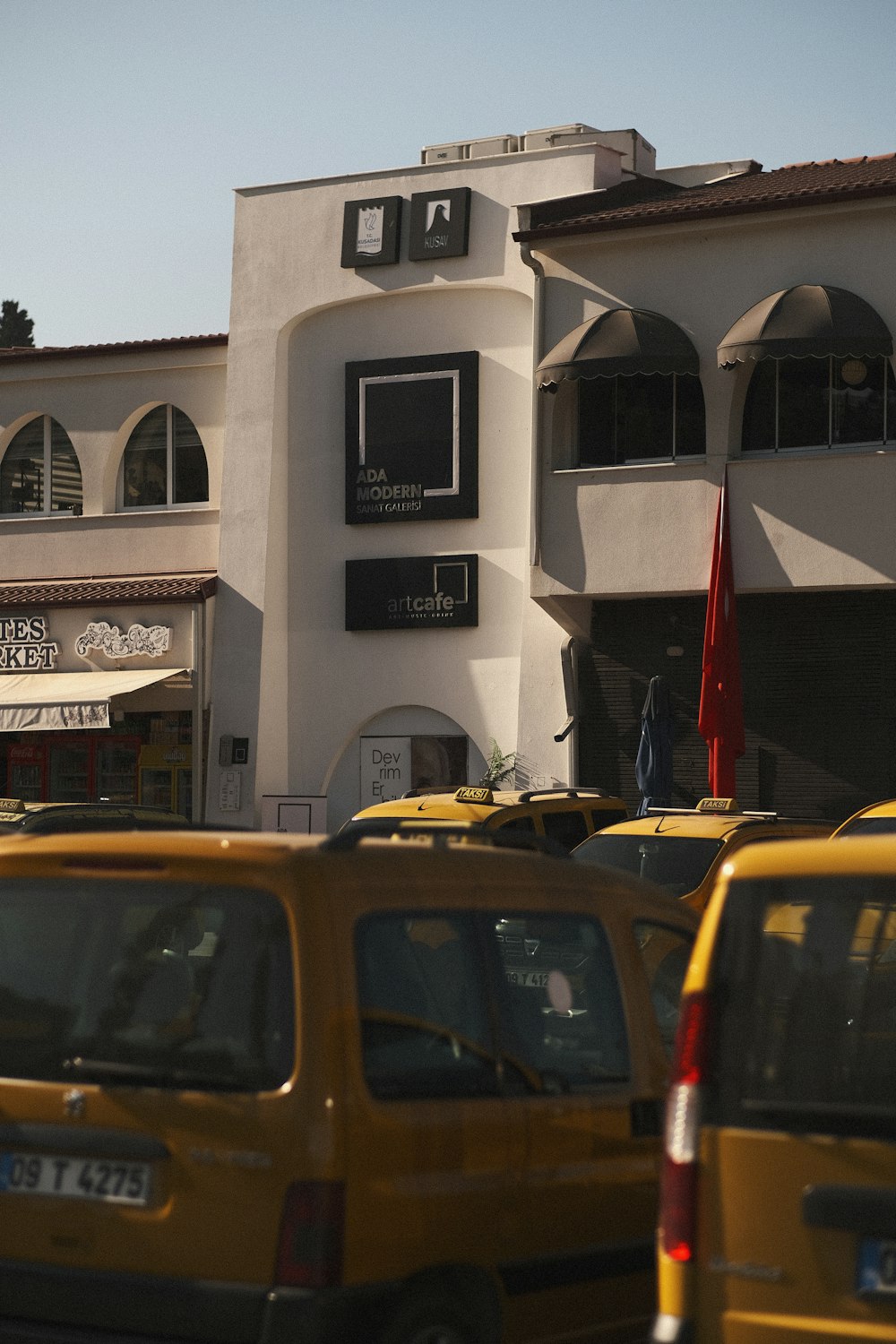 a group of cars parked outside of a building