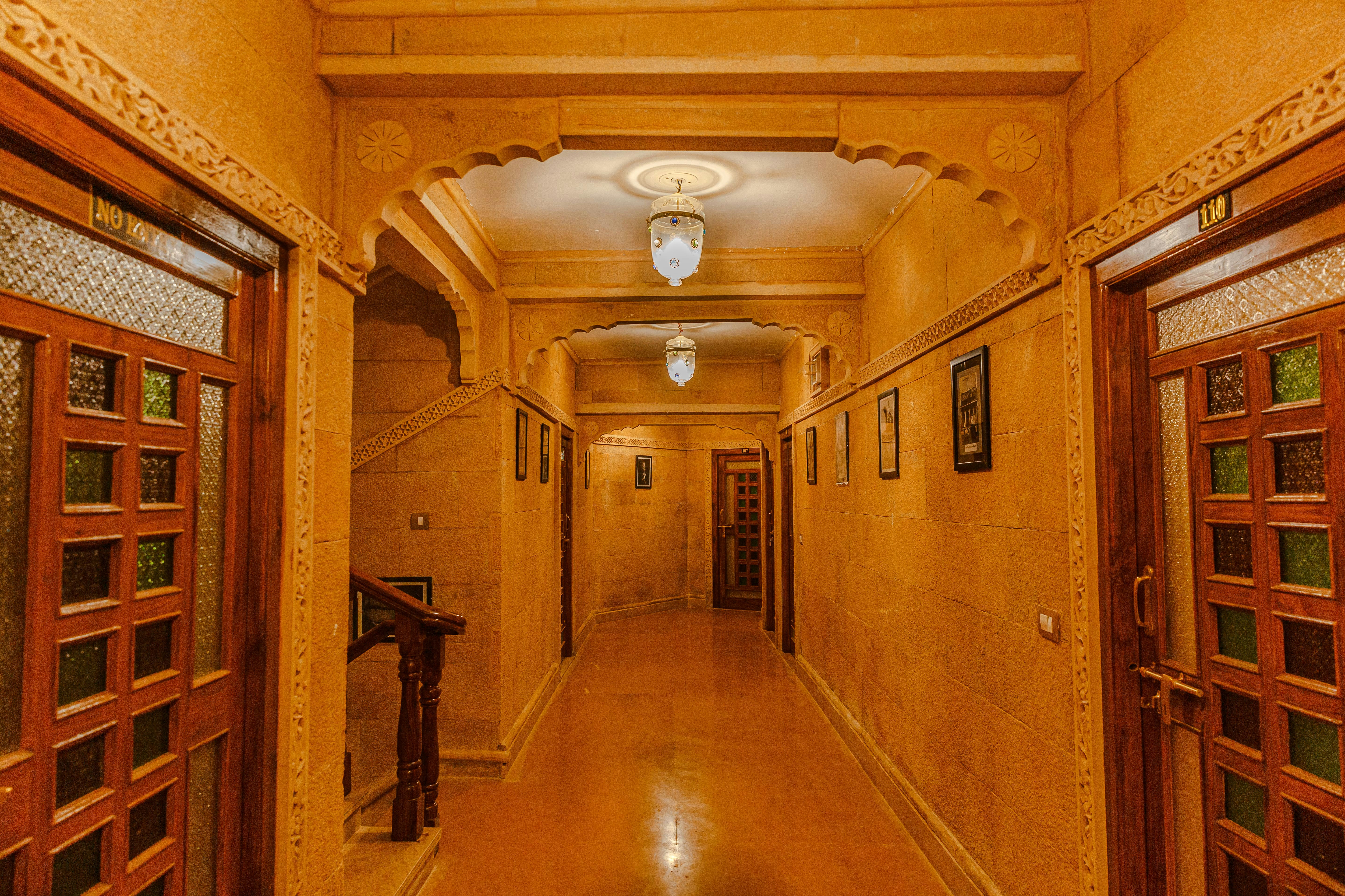 a hallway with wooden doors