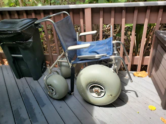 A wheelchair and mobility aids prepared for donation to a local recipient.