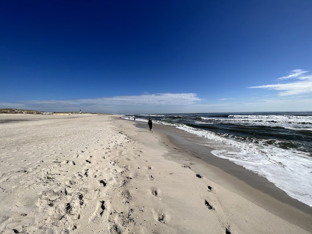 a person walking on a beach