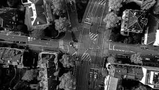 Aerial view of a city intersection with temporary detour signs and barriers set up.