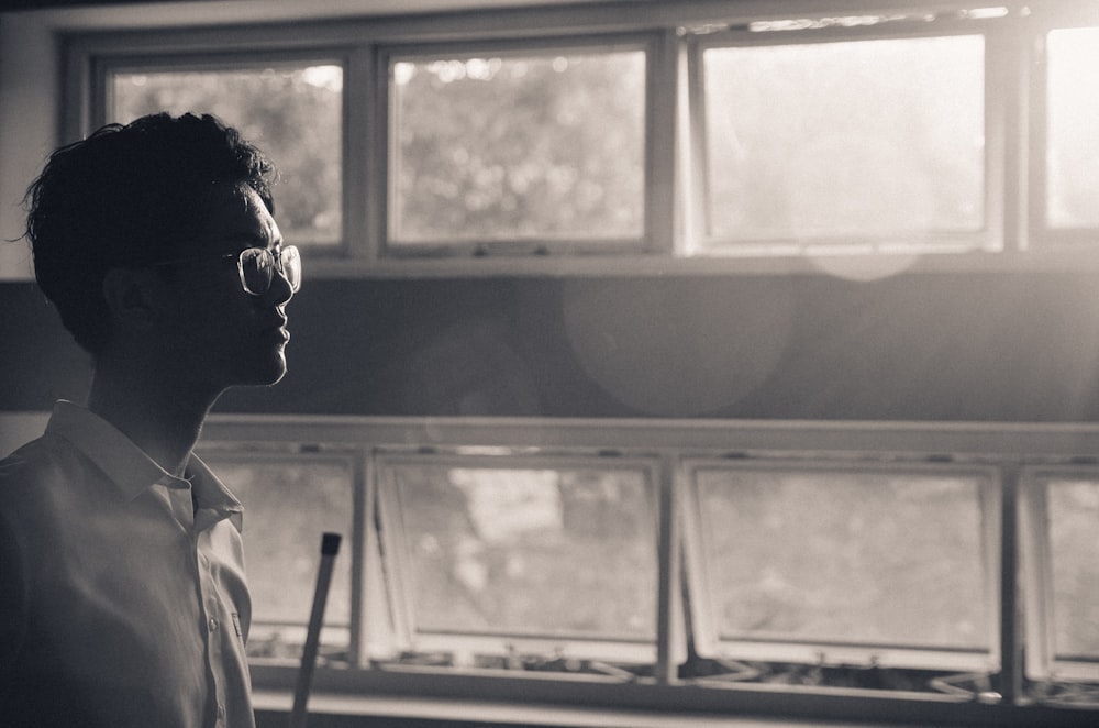 a man looking out a window