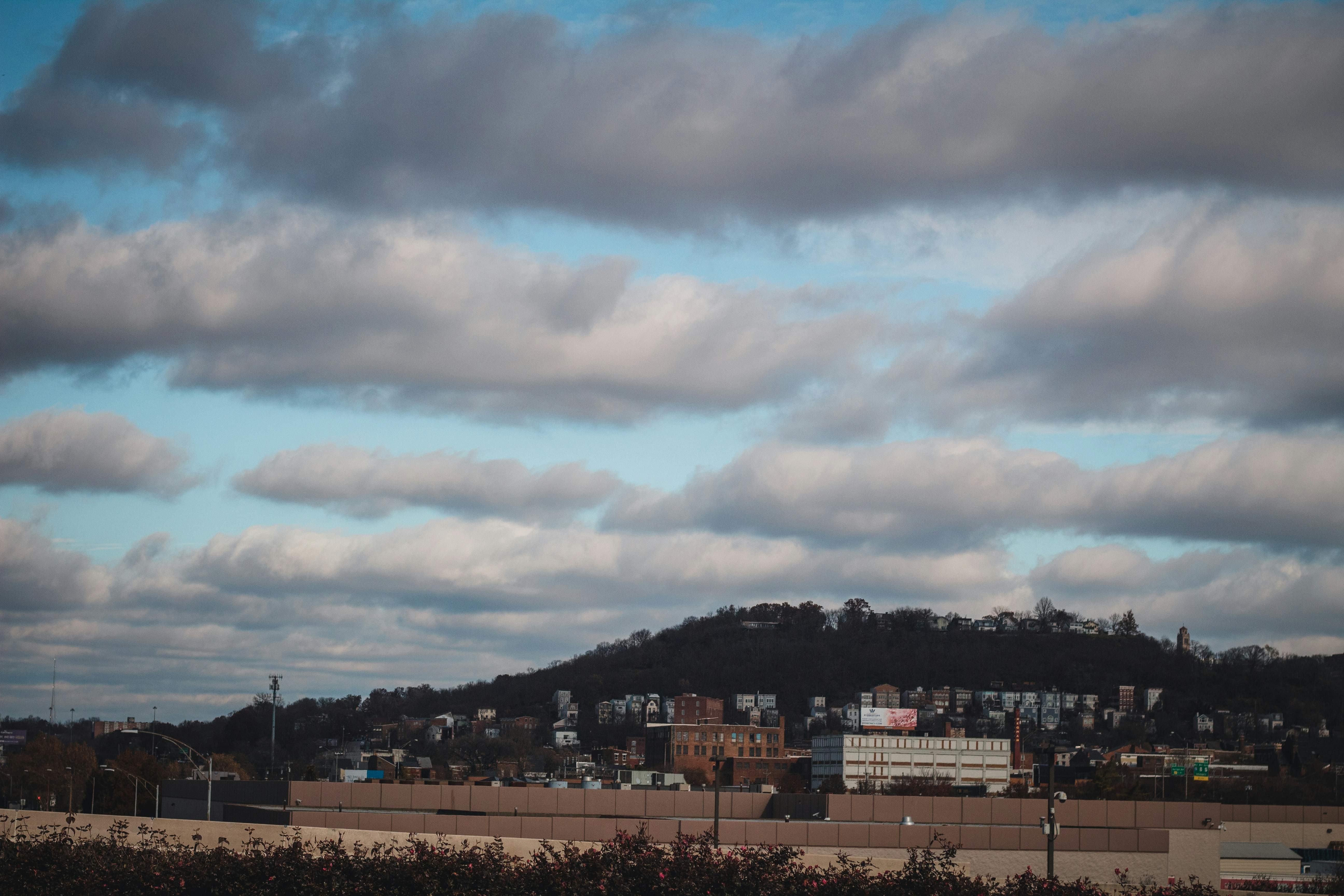 a city with a hill in the background