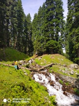 a person standing on a rocky hillside