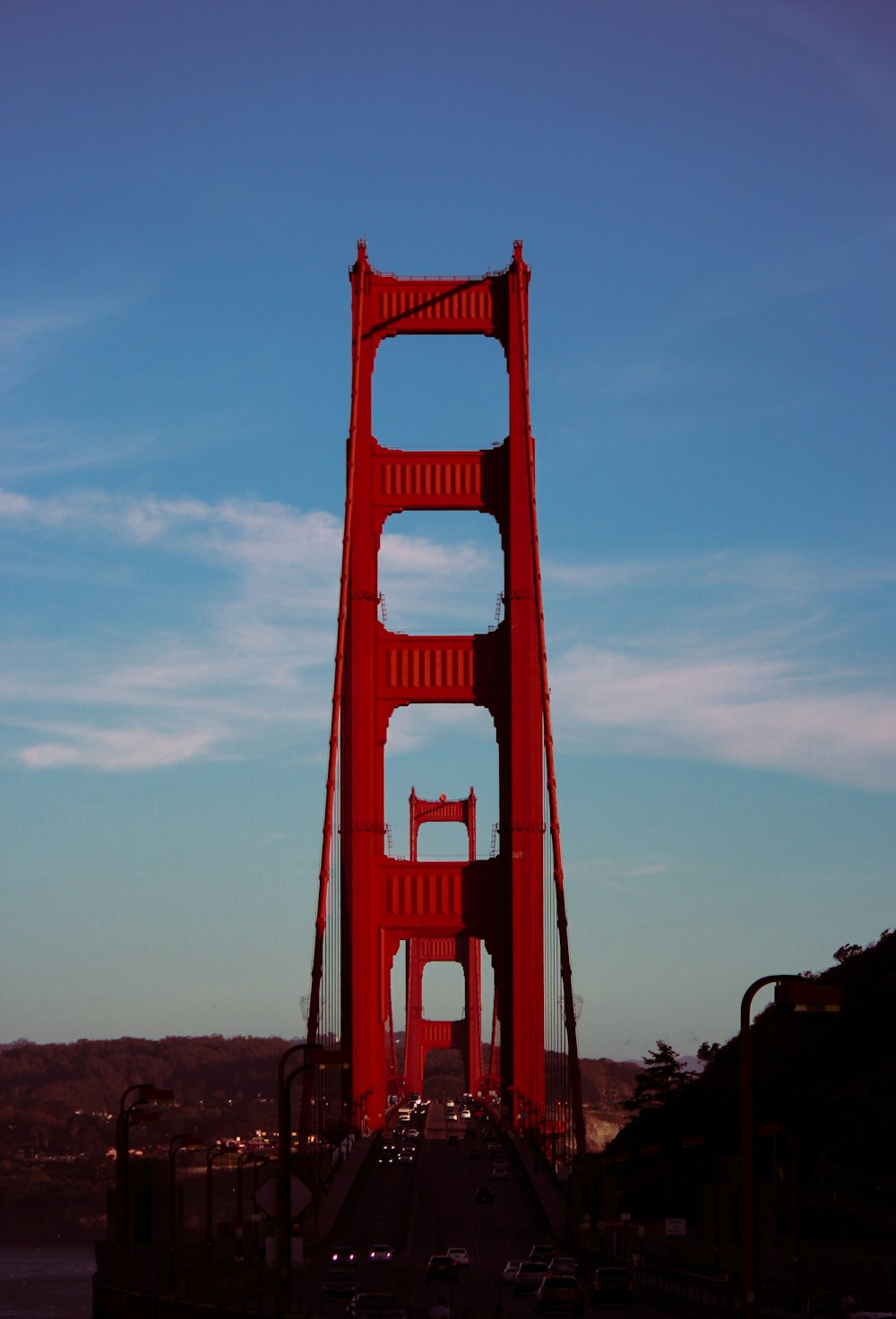 a large red bridge with Golden Gate Bridge in the background