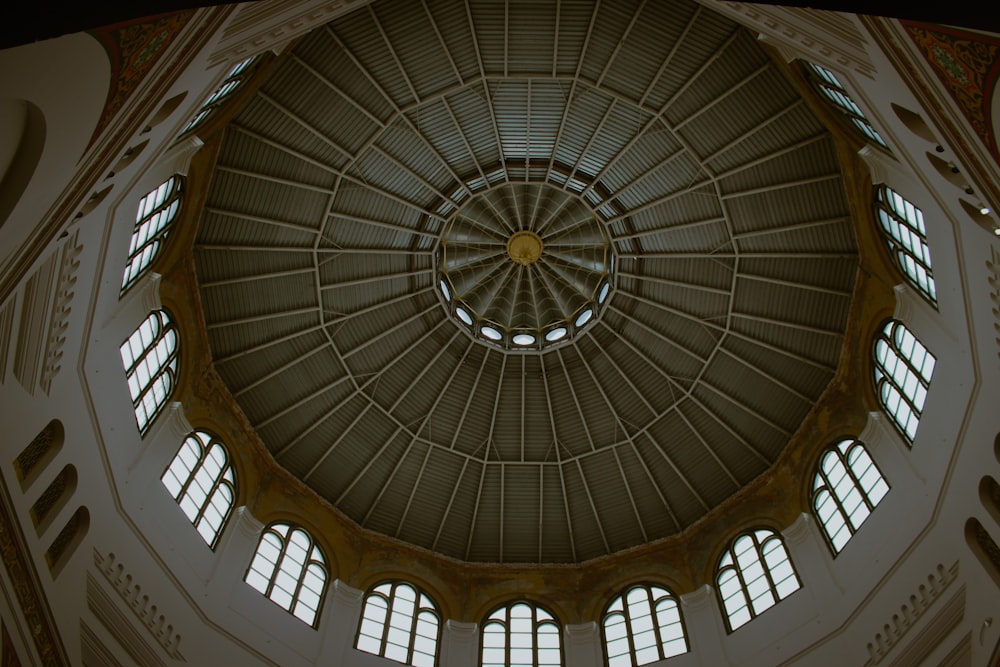 a large domed ceiling with a circular ceiling and many windows