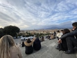 A group of travelers enjoying their time in a scenic European landscape.