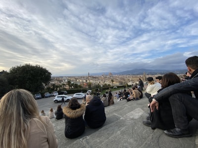 A group of travelers enjoying their time in a scenic European landscape.