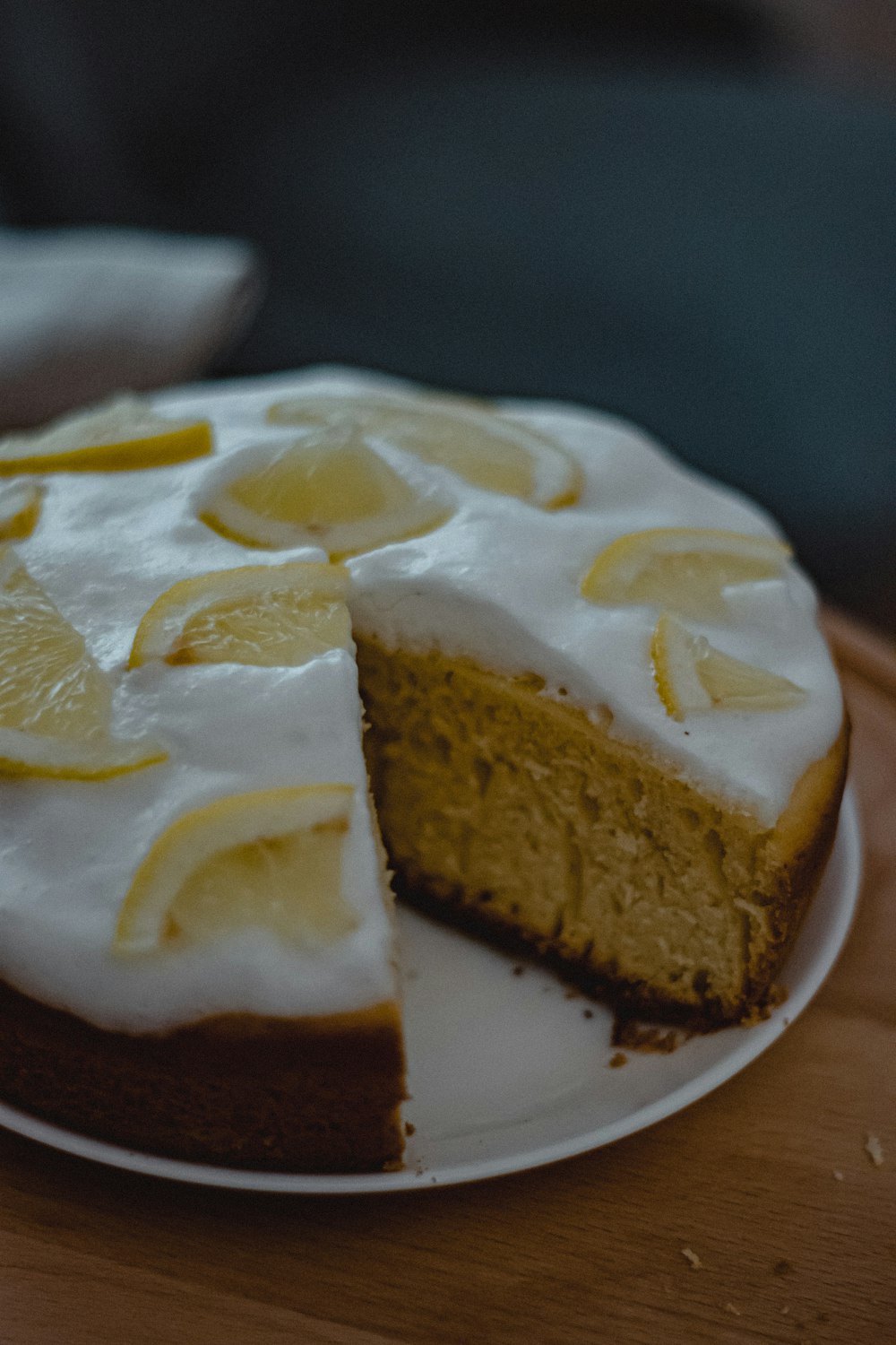 a slice of cake with oranges on top