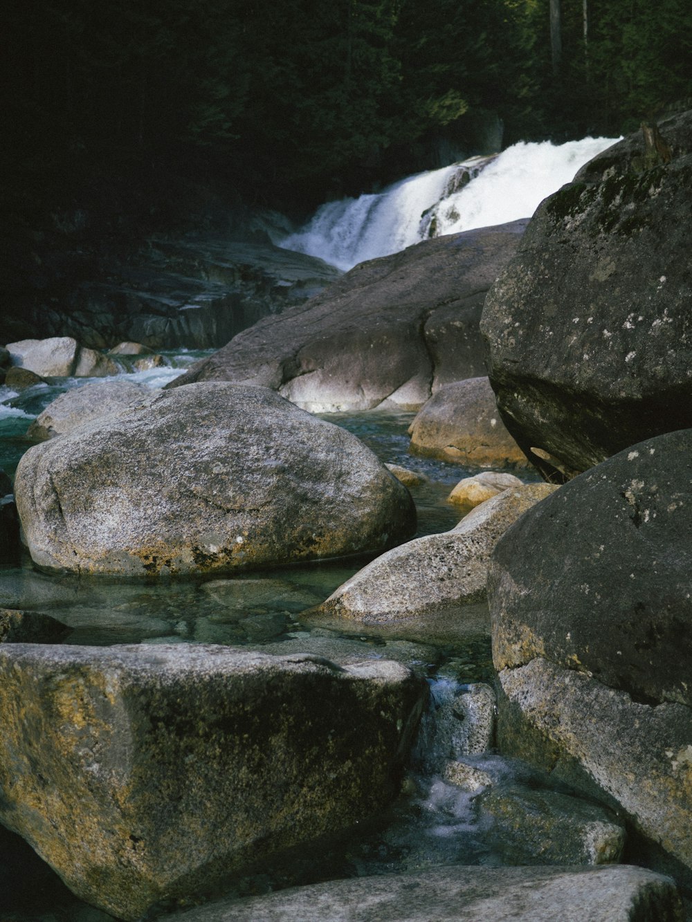 a stream of water flowing over rocks